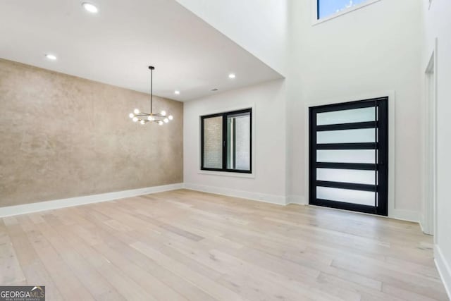 2205 Sugarloaf Pkwy, Lawrenceville, GA 30045 - foyer with a chandelier, light wood finished floors, and recessed lighting