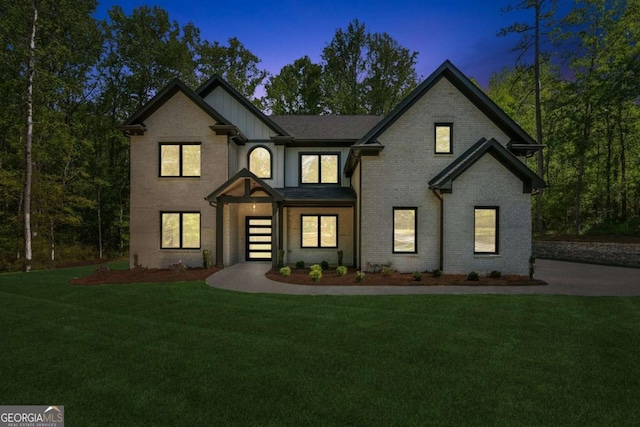 2205 Sugarloaf Pkwy, Lawrenceville, GA 30045 - view of front of property with a lawn, board and batten siding, and brick siding
