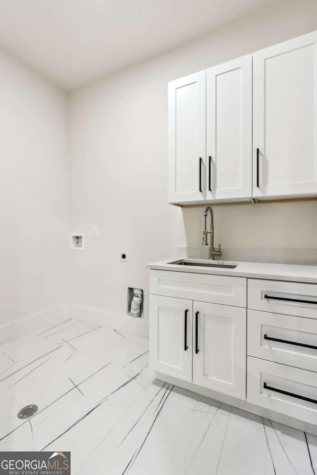 2205 Sugarloaf Pkwy, Lawrenceville, GA 30045 - laundry room featuring washer hookup, hookup for an electric dryer, and cabinet space