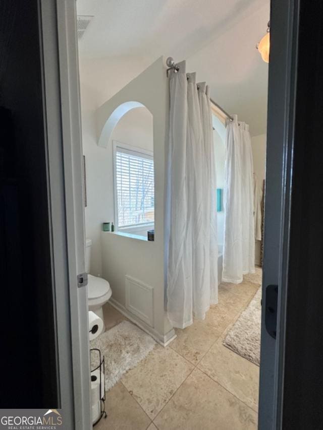 279 S Woods Ct, Jasper, GA 30143 - bathroom with toilet, tile patterned floors, and curtained shower