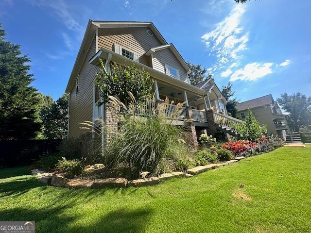 279 S Woods Ct, Jasper, GA 30143 - rear view of house featuring stairway and a yard