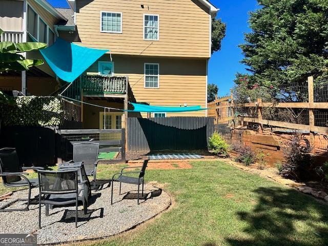 279 S Woods Ct, Jasper, GA 30143 - back of house featuring an outdoor fire pit and a patio area