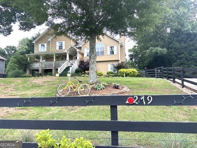 279 S Woods Ct, Jasper, GA 30143 - view of front facade featuring covered porch