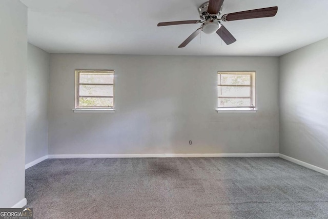 1956 Joseph Ct, Decatur, GA 30032 - carpeted empty room with a healthy amount of sunlight, baseboards, and ceiling fan