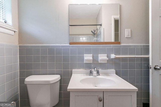 1956 Joseph Ct, Decatur, GA 30032 - bathroom featuring wainscoting, vanity, tile walls, a shower, and toilet