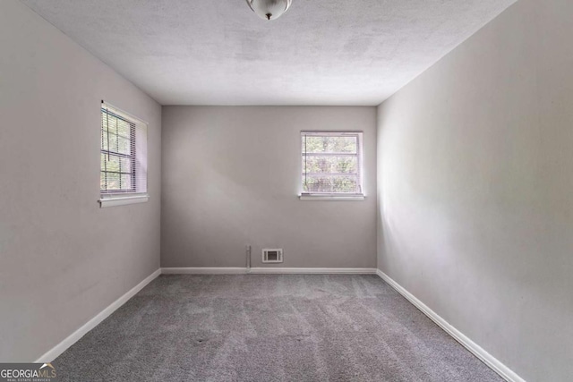 1956 Joseph Ct, Decatur, GA 30032 - carpeted empty room featuring baseboards, visible vents, and plenty of natural light