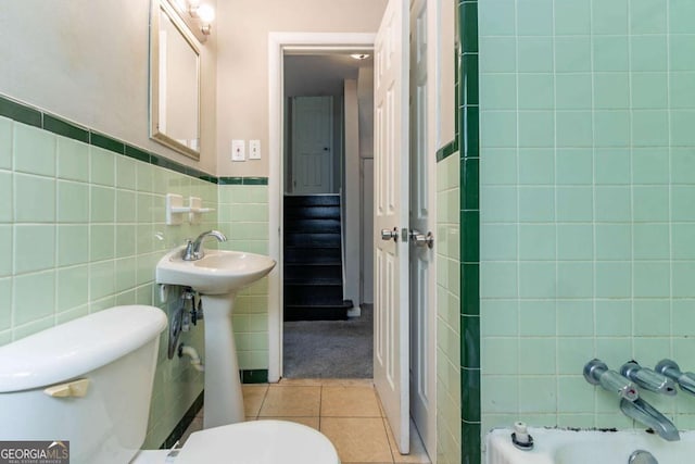 1956 Joseph Ct, Decatur, GA 30032 - full bathroom with tile patterned flooring, tile walls, toilet, and wainscoting