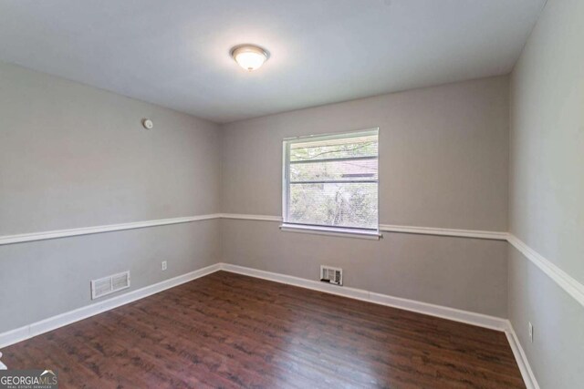 1956 Joseph Ct, Decatur, GA 30032 - spare room with baseboards, wood finished floors, and visible vents