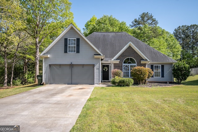 344 River Landing Dr, Monroe, GA 30656 - traditional-style house with concrete driveway, a front lawn, and a garage