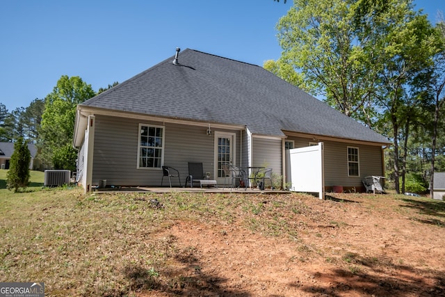 344 River Landing Dr, Monroe, GA 30656 - back of property featuring central air condition unit, a patio area, and roof with shingles