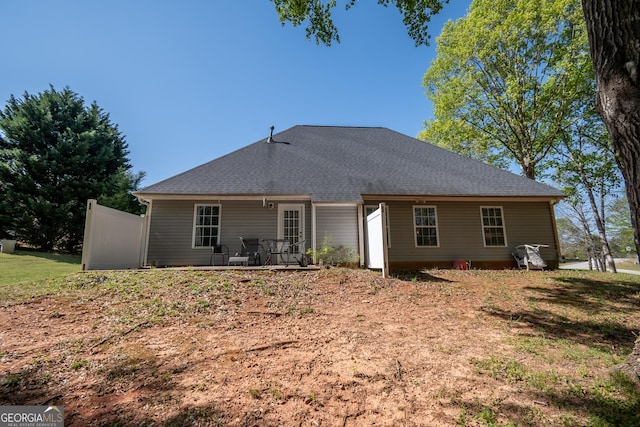 344 River Landing Dr, Monroe, GA 30656 - back of house with a shingled roof and a patio