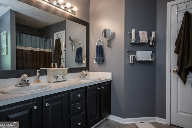 344 River Landing Dr, Monroe, GA 30656 - bathroom featuring double vanity and baseboards