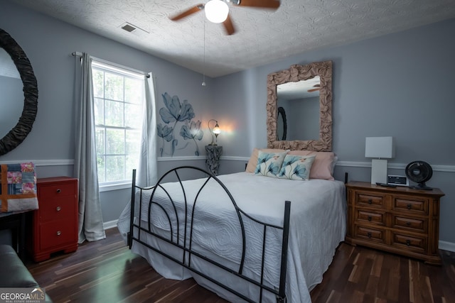 344 River Landing Dr, Monroe, GA 30656 - bedroom with wood finished floors, multiple windows, a ceiling fan, baseboards, and a textured ceiling