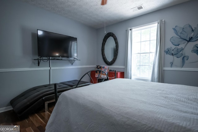 344 River Landing Dr, Monroe, GA 30656 - bedroom featuring wood finished floors, a textured ceiling, and baseboards