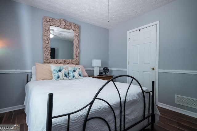 344 River Landing Dr, Monroe, GA 30656 - bedroom with wood finished floors, baseboards, and a textured ceiling