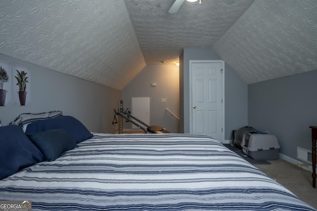 344 River Landing Dr, Monroe, GA 30656 - carpeted bedroom with lofted ceiling, a ceiling fan, a textured ceiling, and baseboards