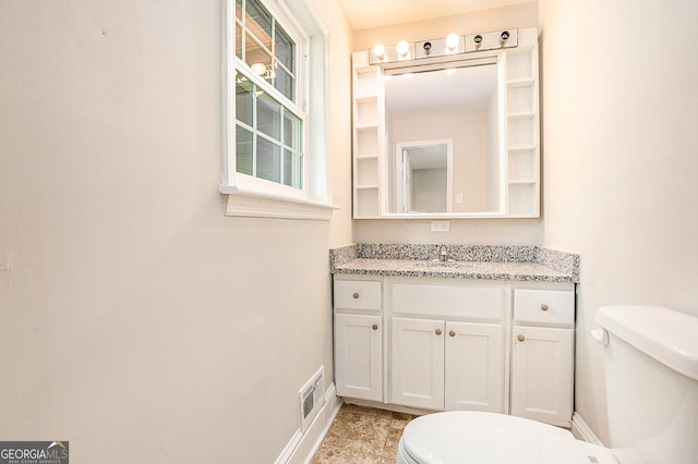 1132 Luther Dr SW, Mableton, GA 30126 - bathroom with baseboards, visible vents, toilet, and vanity