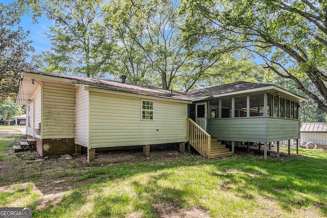 1132 Luther Dr SW, Mableton, GA 30126 - rear view of property featuring a sunroom and a yard