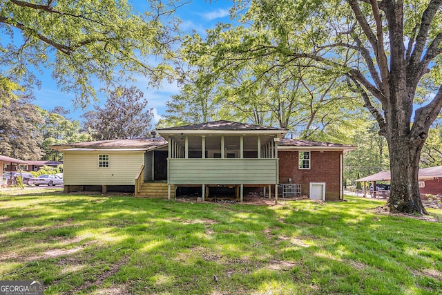 1132 Luther Dr SW, Mableton, GA 30126 - back of house featuring a sunroom and a yard