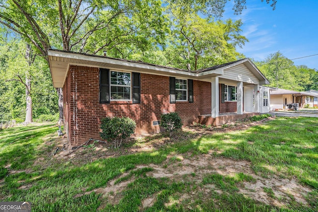 1132 Luther Dr SW, Mableton, GA 30126 - ranch-style house featuring brick siding, a porch, a front lawn, and crawl space