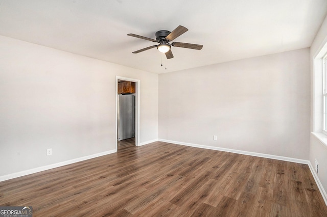 1132 Luther Dr SW, Mableton, GA 30126 - empty room featuring baseboards, a ceiling fan, and wood finished floors