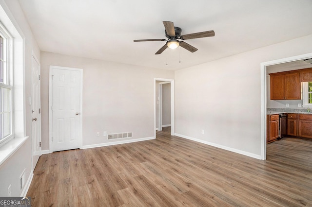 1132 Luther Dr SW, Mableton, GA 30126 - interior space featuring light wood finished floors, baseboards, a ceiling fan, and visible vents