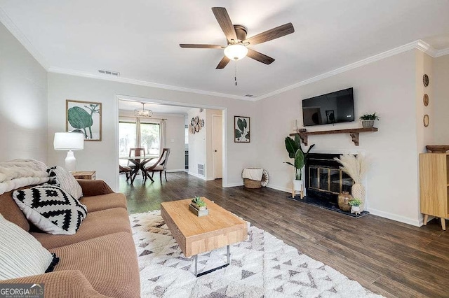 33 Hidden Lake Ct, Savannah, GA 31419 - living area with crown molding, wood finished floors, ceiling fan, and a glass covered fireplace