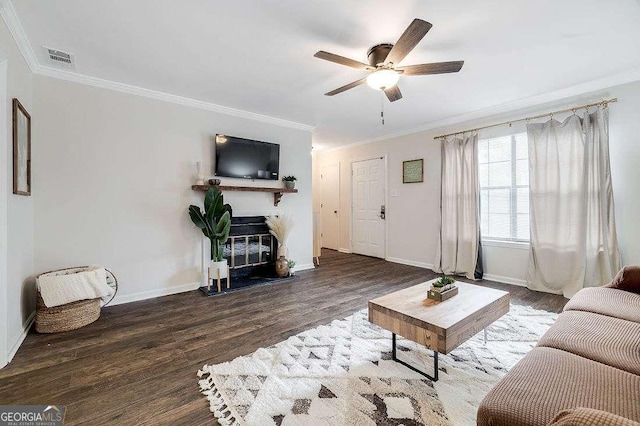 33 Hidden Lake Ct, Savannah, GA 31419 - living room featuring crown molding, wood finished floors, ceiling fan, and a glass covered fireplace