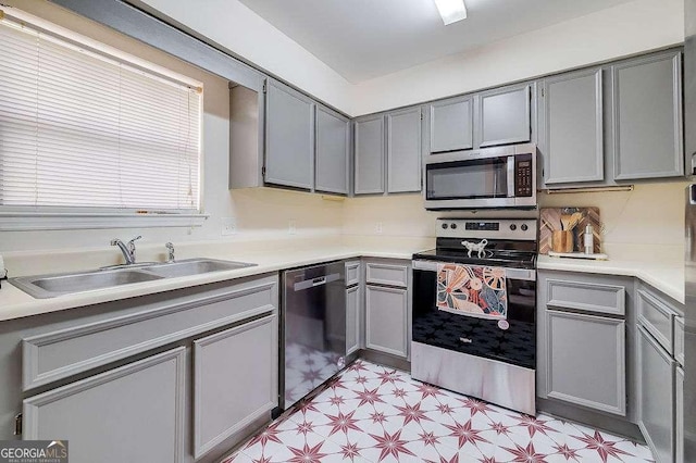 33 Hidden Lake Ct, Savannah, GA 31419 - kitchen featuring stainless steel appliances, gray cabinetry, light floors, and light countertops