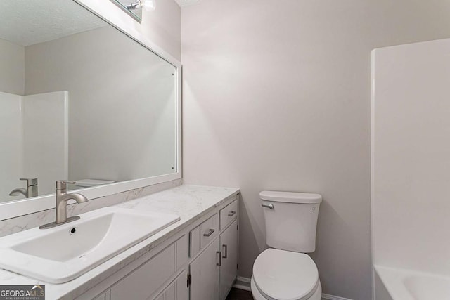 842 Brighton Dr, Lawrenceville, GA 30043 - bathroom with a washtub, toilet, and vanity