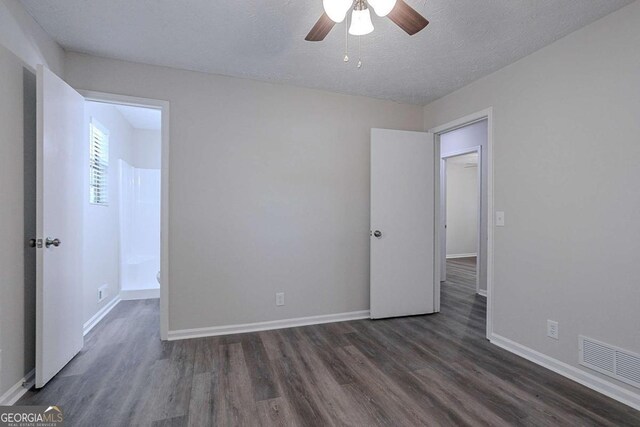842 Brighton Dr, Lawrenceville, GA 30043 - unfurnished bedroom featuring baseboards, visible vents, and dark wood finished floors