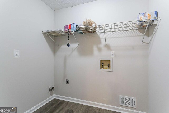 842 Brighton Dr, Lawrenceville, GA 30043 - laundry area featuring hookup for an electric dryer, dark wood finished floors, baseboards, visible vents, and washer hookup