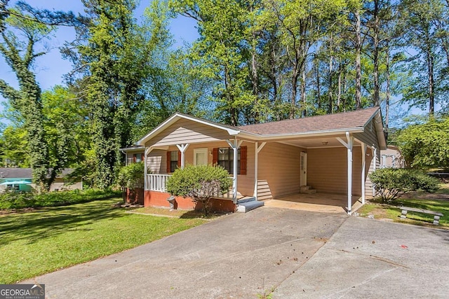 842 Brighton Dr, Lawrenceville, GA 30043 - view of front of property with covered porch, an attached carport, a front yard, and concrete driveway