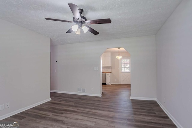 842 Brighton Dr, Lawrenceville, GA 30043 - spare room featuring arched walkways, a textured ceiling, visible vents, and ceiling fan
