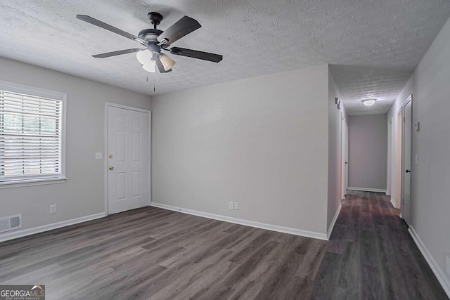 842 Brighton Dr, Lawrenceville, GA 30043 - spare room with wood finished floors, visible vents, a ceiling fan, baseboards, and a textured ceiling