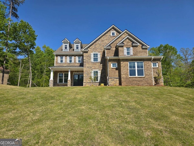 craftsman-style house with a front yard
