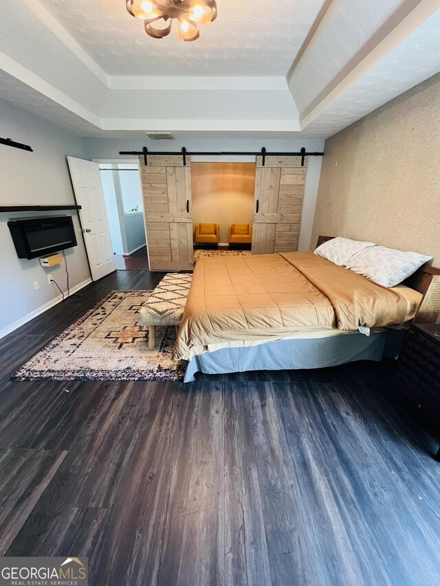 unfurnished room with lofted ceiling, baseboards, and wood finished floors
