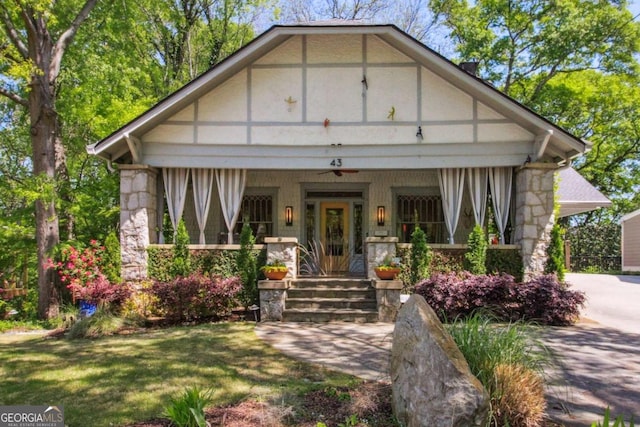 view of front facade featuring a porch and stone siding