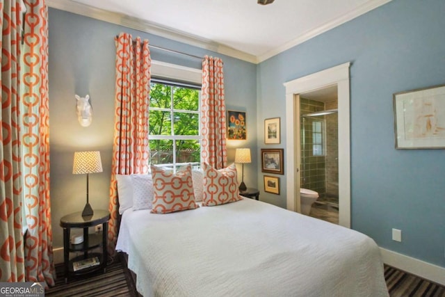 bedroom with ornamental molding, baseboards, and ensuite bathroom