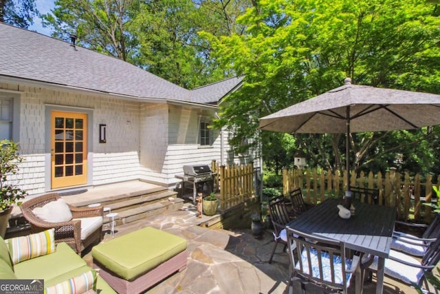 view of patio featuring outdoor dining area, a grill, and an outdoor hangout area