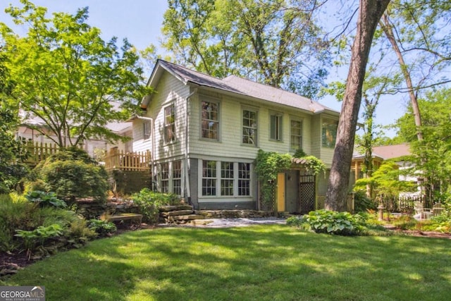 view of home's exterior with a yard