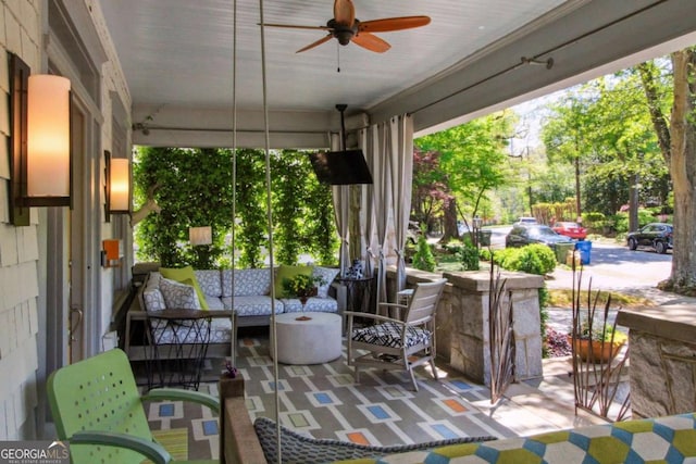 view of patio / terrace with an outdoor living space and ceiling fan