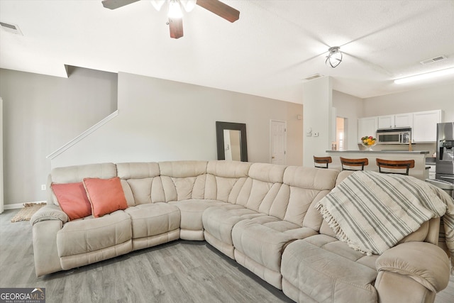 384 Parc River Blvd, Lawrenceville, GA 30046 - living room featuring light wood-style floors, ceiling fan, and baseboards