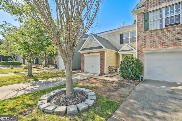 384 Parc River Blvd, Lawrenceville, GA 30046 - view of front of house with brick siding, concrete driveway, and an attached garage