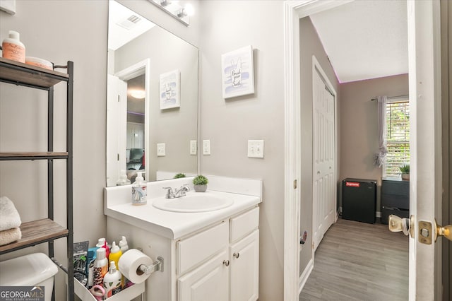 384 Parc River Blvd, Lawrenceville, GA 30046 - bathroom featuring vanity, wood finished floors, and baseboards