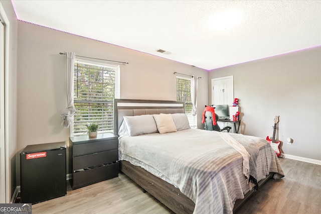 384 Parc River Blvd, Lawrenceville, GA 30046 - bedroom featuring light wood-style flooring and baseboards