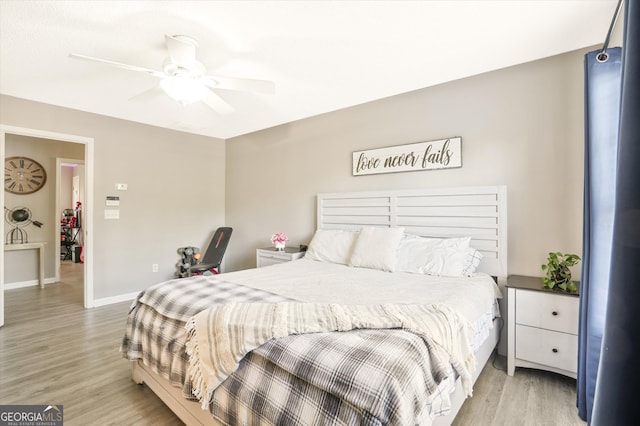 384 Parc River Blvd, Lawrenceville, GA 30046 - bedroom with light wood-style flooring, baseboards, and ceiling fan