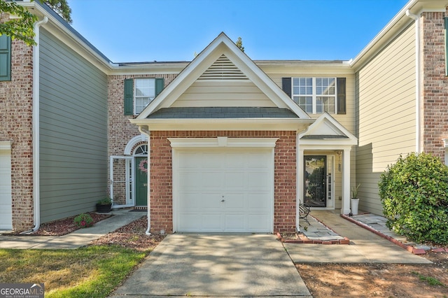 384 Parc River Blvd, Lawrenceville, GA 30046 - traditional home featuring concrete driveway, a garage, and brick siding