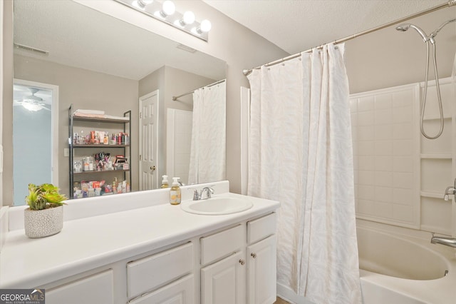 384 Parc River Blvd, Lawrenceville, GA 30046 - bathroom featuring vanity, shower / bath combo, and a textured ceiling