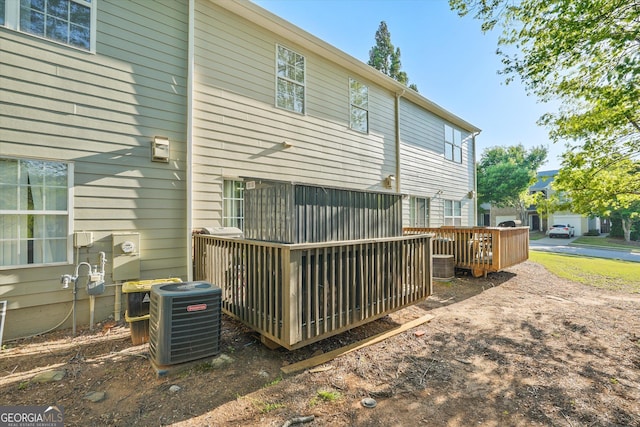 384 Parc River Blvd, Lawrenceville, GA 30046 - back of house with cooling unit and a wooden deck